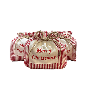 Bolsa de regalo con cord&oacute;n de rayas navide&ntilde;as